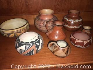 An assortment of signed and unsigned Southwestern pottery.