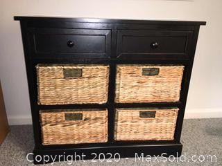 Small black accent cabinet with 4 woven drawers.