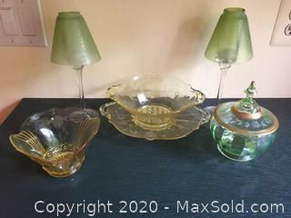 An assortment of yellow and green depression glass