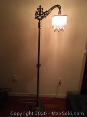 Antique Cast Floor Lamp with beaded shade.