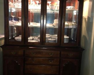 American Drew Lighted china cabinet with matching dining room table and chairs.