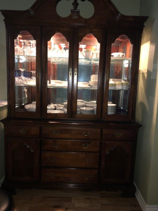 American Drew Lighted china cabinet with matching dining room table and chairs.