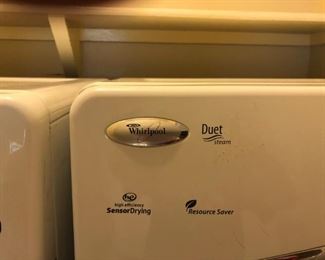 White Whirlpool Duet washer and dryer, approximately 5 years  old, with bases.