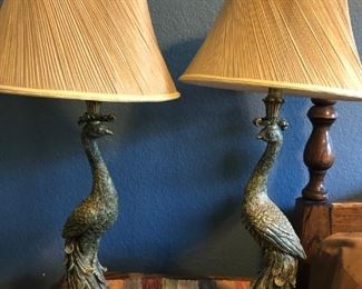 Beautiful pair of peacock lamps with lined shades.