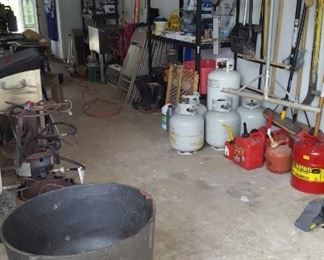 Tools, gas cans, cast iron cooker, gas tanks