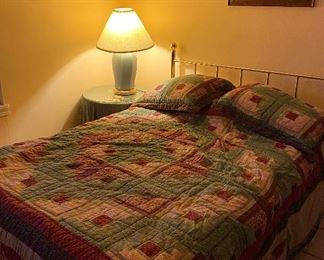 Full Size Bed with Chrome/Brass Like Headboard (2), Comforters, Round Night Table, Lamp, World Map, Needlepoint in Spanish