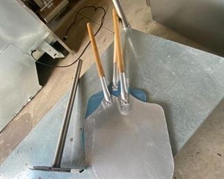 3 pizza peels and an oven cleaner