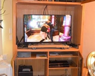 Entertainment Center.  TV Visio E43c2 Flat Screen 43”.  Blue Ray DVD players 2,  6 Polk audio speakers – with power sub-woofer .