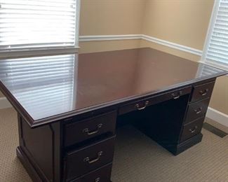 #21	Jacobs desk dark cherry look wood  with 2 legal file drawers and 3 other drawers 76x42x30 with decortive raised side 	 $275.00 
