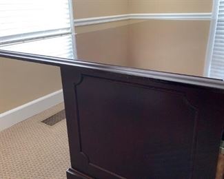 #21	Jacobs desk dark cherry look wood  with 2 legal file drawers and 3 other drawers 76x42x30 with decortive raised side 	 $275.00 
