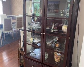 $350 BROWN WOOD AND GLASS LIGHTED DISPLAY CABINET
41.25”W x 14”D x 68.25”H
