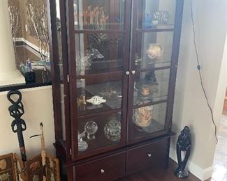 $350 BROWN WOOD AND GLASS LIGHTED DISPLAY CABINET
41.25”W x 14”D x 68.25”H
