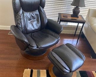 $50  BLACK FAUX LEATHER CHAIR WITH OTTOMAN - SOLD AS IS / PEELING 