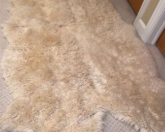 $65 NEW ZEALAND TANNED LAMBSKIN RUG 
76”L x 44”W