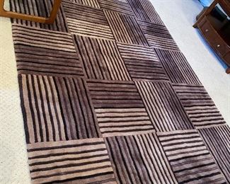 $120 BROWN AREA RUG 
100”L x 63”W