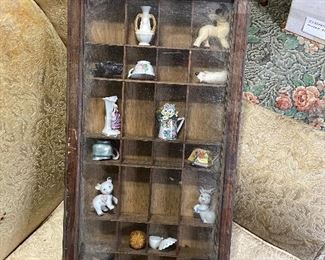 miniatures curio shelf 
