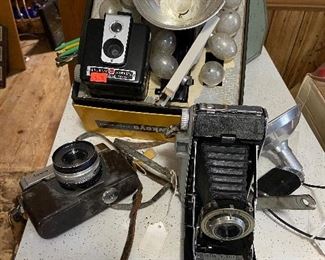 several vintage cameras