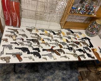 dozens of vintage cap guns - hubley - kilgore - star - cast iron ones - and more