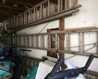 SEVERAL OLD WOODEN LADDERS