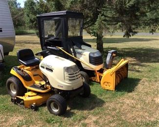 CUB CADETS THEY EACH HAVE A SNOWLOWER AND MOWING ATTACHMENT