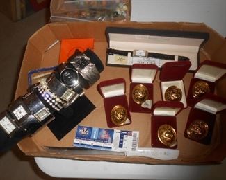 Watches and rosaries in gold containers