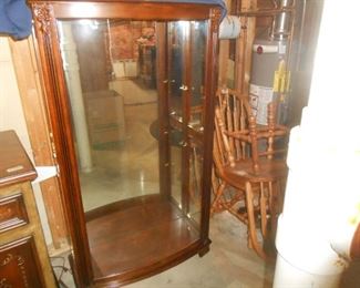 This curio cabinet is approx 5' tall and 3' wide with several adjustable shelves.