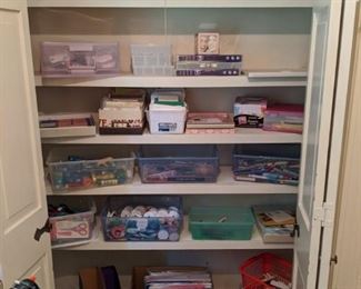 Assorted bins full of paper, scissors, pens, pencils, adhesives, embelishments, and more!