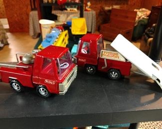 A pair of Buddy L Cab trucks