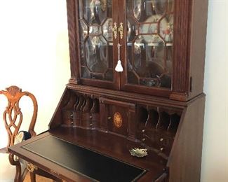 Antique Mahogany with bowed glass doors, leather desk top
