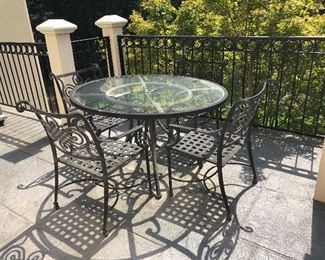 Metal table and four chairs (lattice seats)
