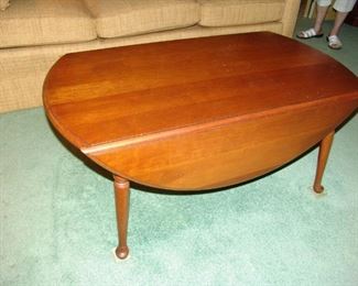 Cocktail table with drop leaf