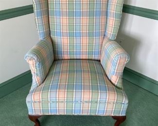 Upholstered Pink plaid wingback chair