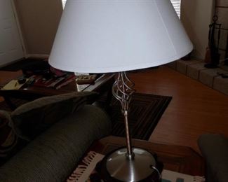 Brushed steel table lamp on end table $30...not a great photo but nice lamp....like new like everything else at this sale....Don't Miss Out !!!   Call NOW...(760) 445-8571