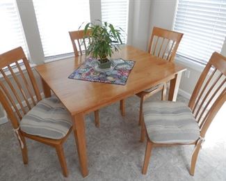 SOLID HARDWOOD (light mahogany) DINING SET also ROCK SOLID...no wobbles....48"x36" table with 4 arts and crafts style chairs....all as new.   ....$325..... Sale in progress NOW...Just call, make appointment, come look and purchase!  (760) 445-8571  Charlotte