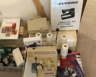 Janome sewing machine.
Baby Lock serger
Sewing supplies