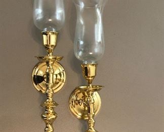 Heavy brass candle sconces with hurricane globes. Candles included.