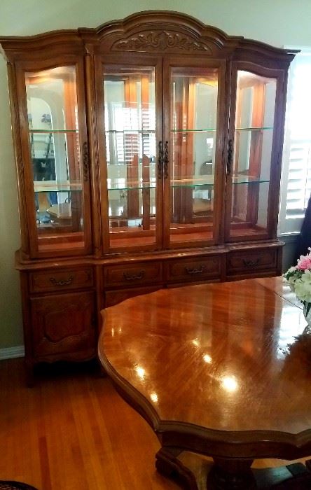 China Cabinet with interior lights.  Stunning in person.  Matching table with two leafs, and table protector.  Six chairs.