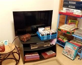Flat screen TV, VCR, and DVDs, and games.