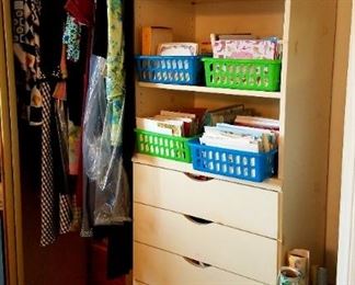 Clothes, for everyday clothes to dressier cloths.  There is a large walk-in closet (not shown here).  Greeting cards in the baskets.