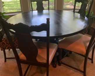 Antique round dining table with 5 chairs. 