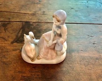 $20 Small sculpture of girl with two ducks.  6" W, 7" H. 