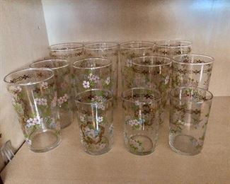 $60  Set of gold and painted drinking glasses: iced tea (4) 5.25" H, water (5) 4.75" H, juice (3) 3.5" H. 