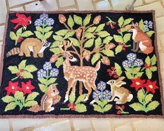 $60 Animal and flower rug.  35" W x 24" H. 