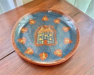 $75  Foltz pottery stamped plate.  13" diam. 