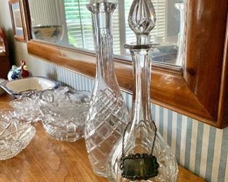 $35 Decanter with medallion (5" diam, 14" H) , $25 decanter in the back (4" diam, 16" H). 