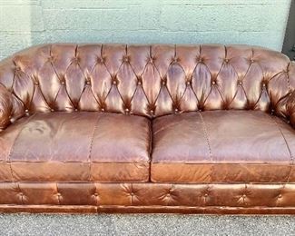 $395 EACH! TWO AVAILABLE!!  Chocolate, brown leather tufted back, roll arm couch with bun feet.  35.5"H x 41"D x 96"W