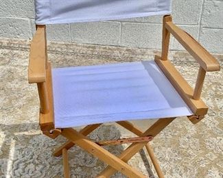 $30 each - Wood frame directors chair with white seat and back.  20 available.  33.5"H x 16.5"D x 21"W