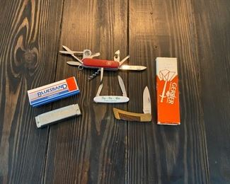 Swiss Army knife, GERBER knife, and Harmonica