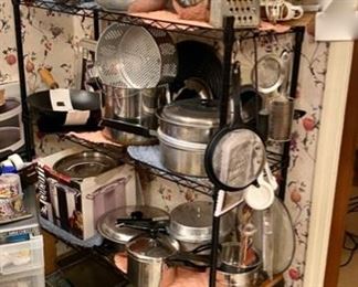 Baking Pans, Pyrex, Several Pressure Cookers still in original boxes, Canning Jars and Large Black Enamelware Pots