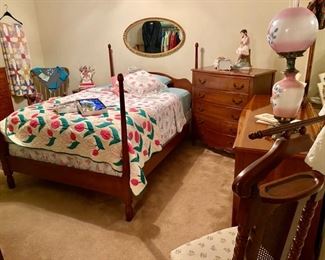 Antique Full Size Cherry Bedroom Suite, Handmade Quilts, and an Oval Wooden Framed Mirror
